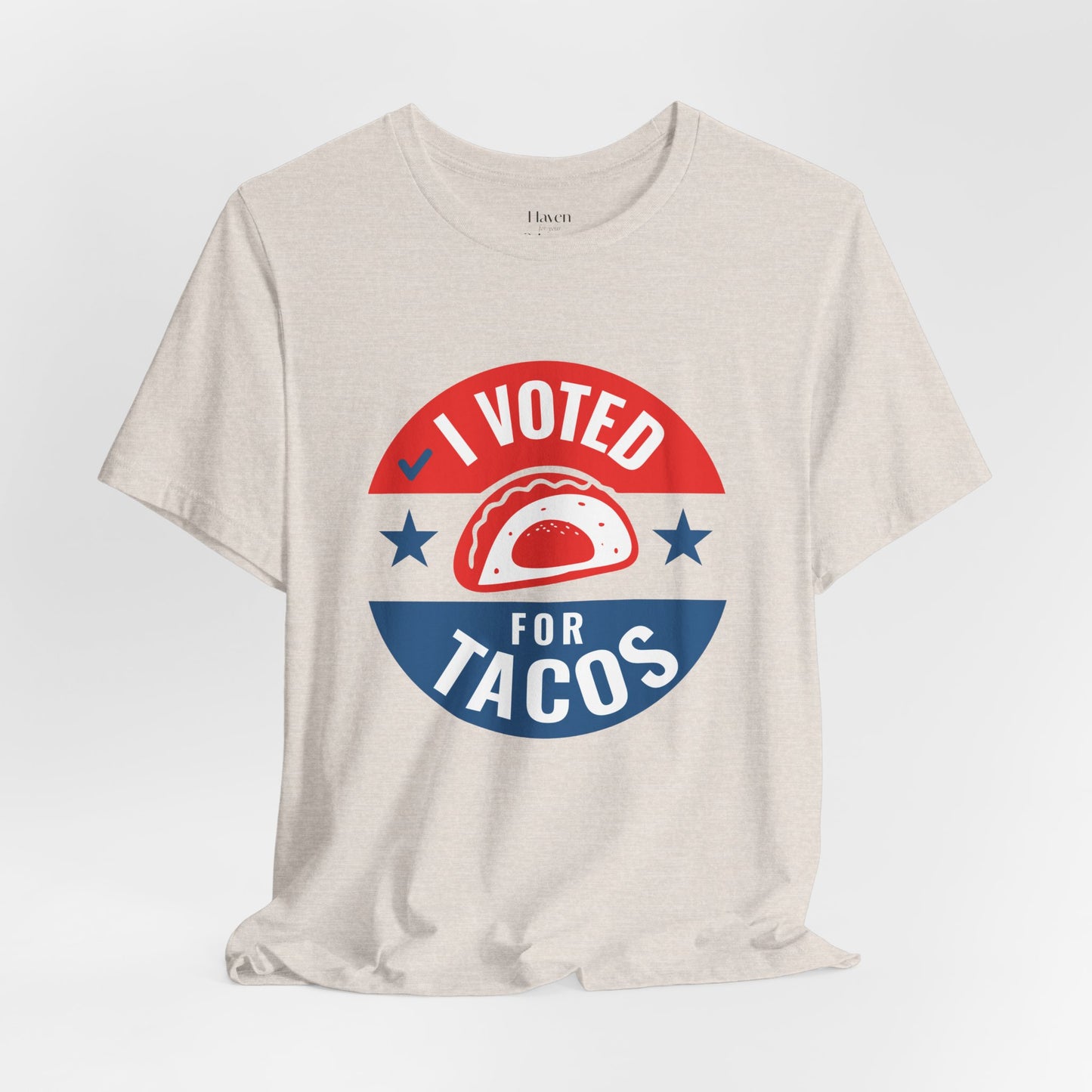 Beige t-shirt with 'I Voted for Tacos' graphic design on a white background