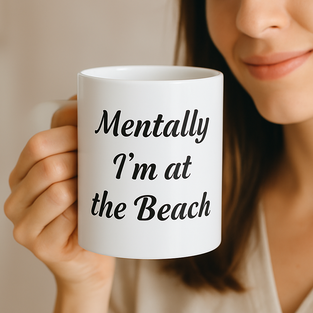 Person holding a white mug with 'Mentally I'm at the Beach' text